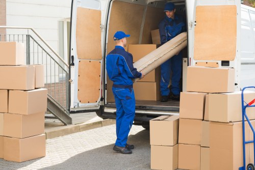 Man and van loading furniture for a local move in Woodside