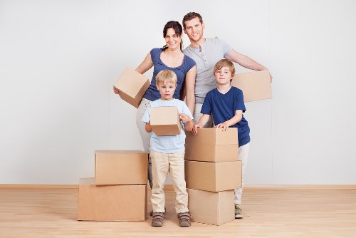 Local truck moving boxes and furniture near Woodside properties