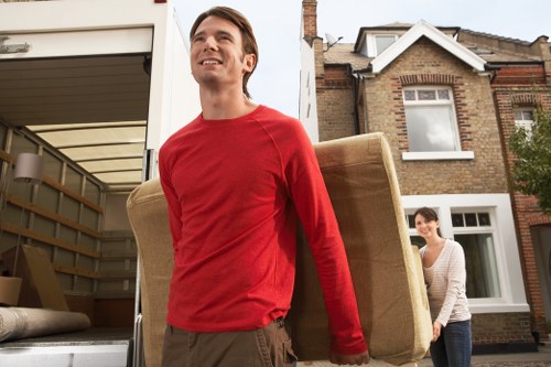 Professional moving truck service handling household items in Woodside