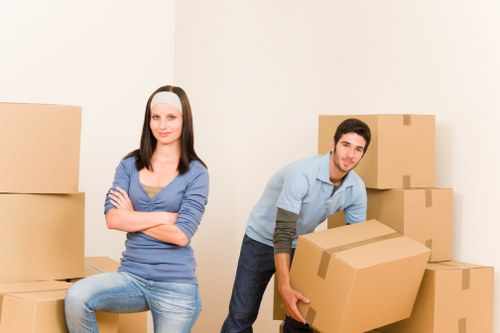 Packed moving boxes and furniture ready for transport in Woodside
