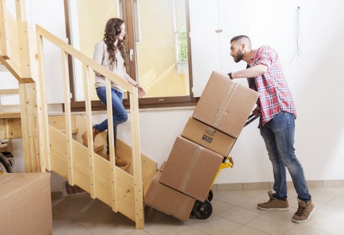 Local team removing furniture from a flat in Woodside with limited access