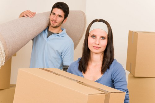 Packed office boxes and furniture ready for removal in Woodside