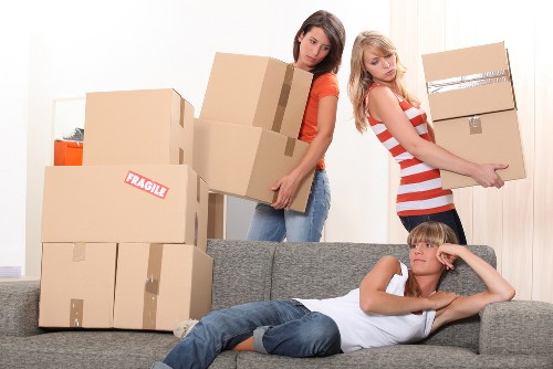 Unpacking support helping a family settle into a new Woodside home