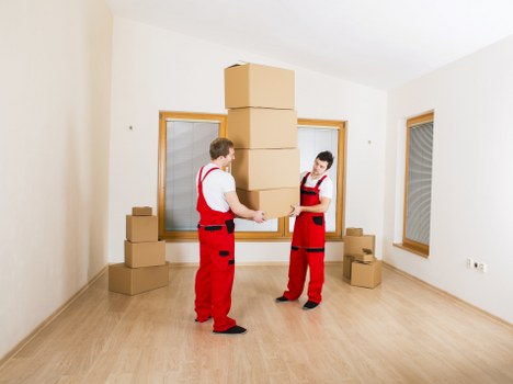 Packed moving boxes ready for transport in a Woodside house move