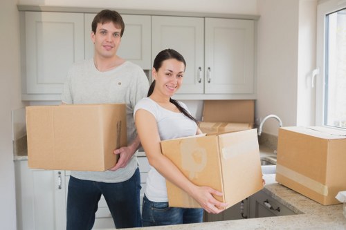 Packed moving boxes and wrapped furniture prepared for transport